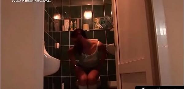  Teen horny girl vibrating pussy in a public toilet